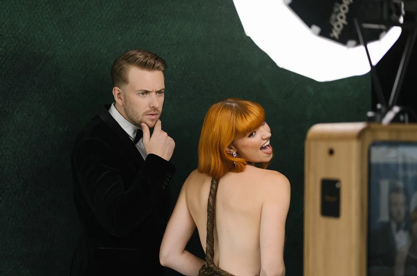 Guests enjoying an FX photo booth at an event
