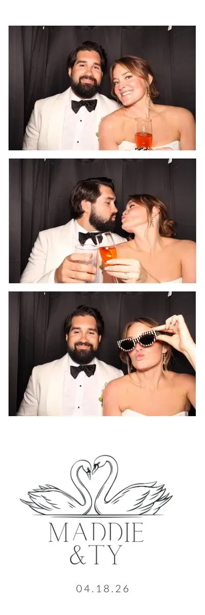 Guests posing in the enclosed booth