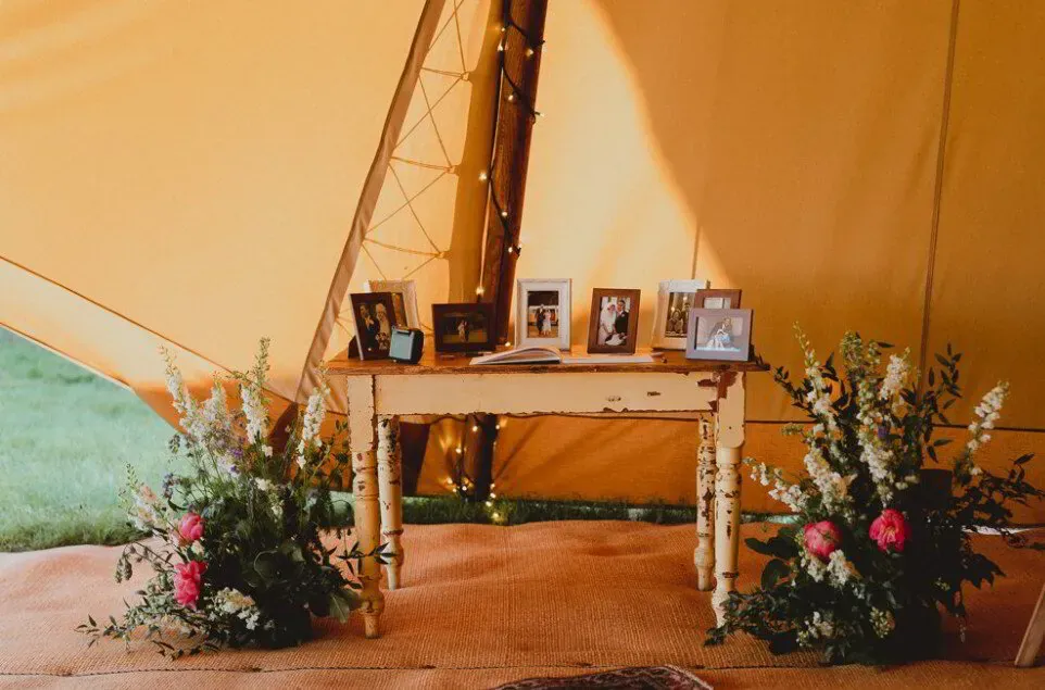 Guests leaving handwritten notes beside photos