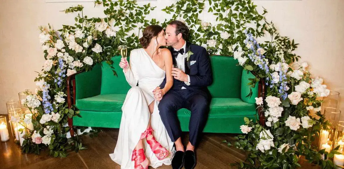 Wedding photo booth anchoring a lounge area
