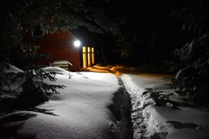 Mountain lodge in winter evening scene